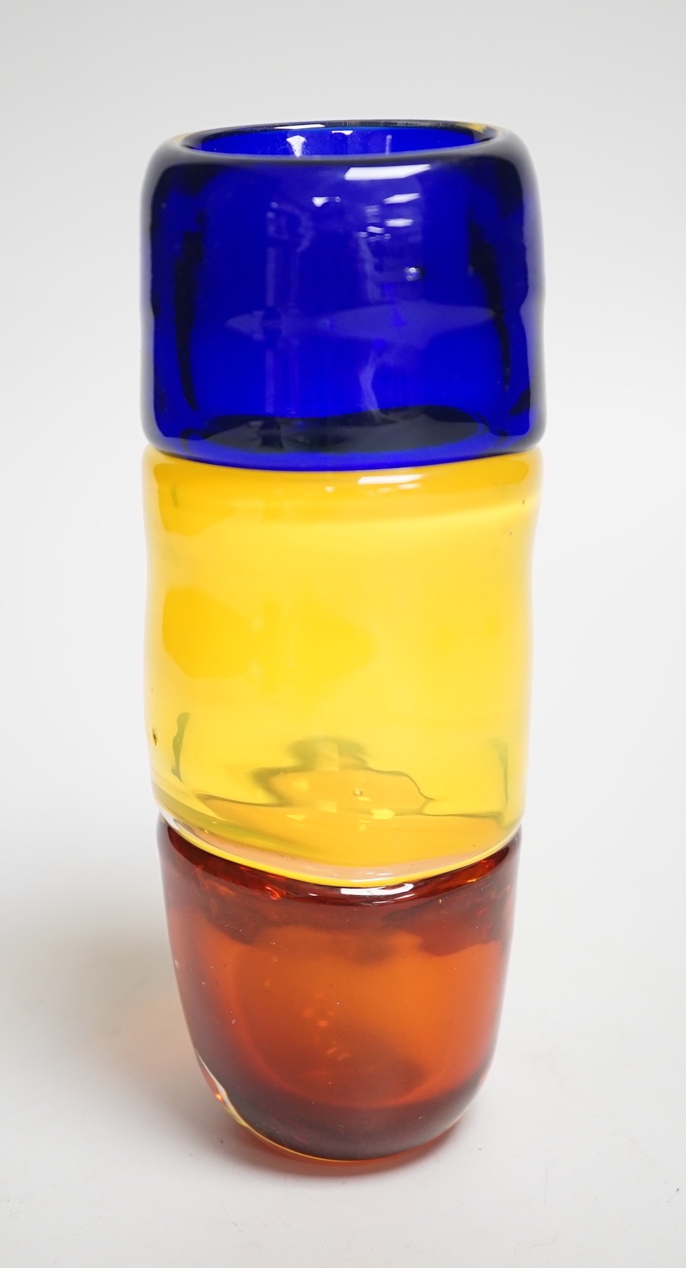 A signed Mike Frolich fused three colour glass vase. 19cm high